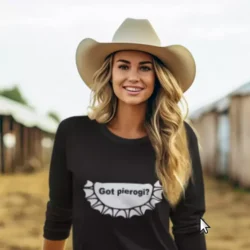 Blonde cowgirl with a cowboy hat wearing a Got Pierogi shirt from Mrugacz.