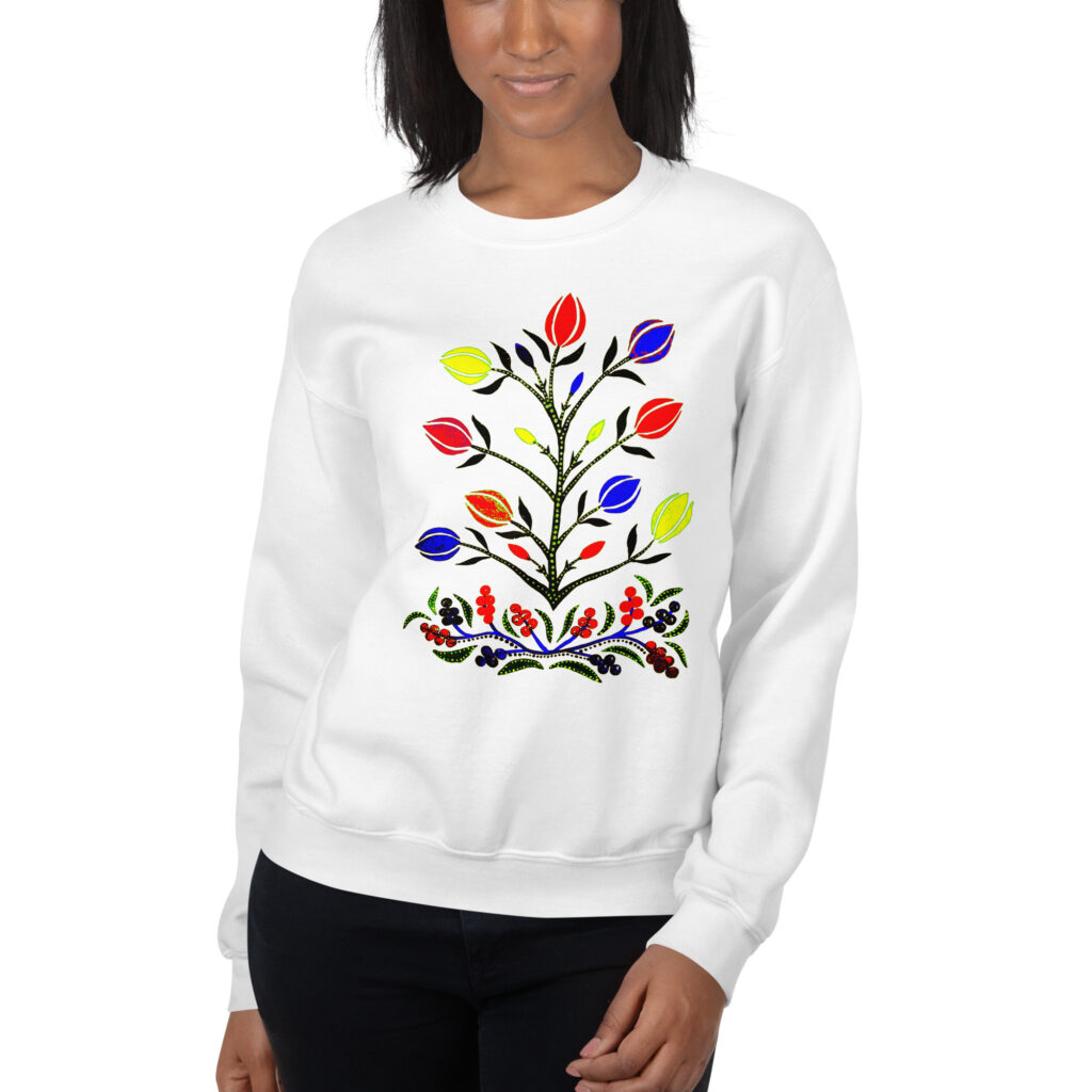 Woman wearing a comfy Colorful Slavic Flowers Sweatshirt by Mrugacz, one of the  First Signs of Spring.