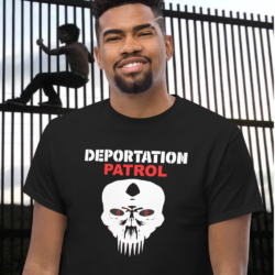 Peoud MAGA Amaerican wearing a black Deportation Patrol Squad Shirt at the border wall.